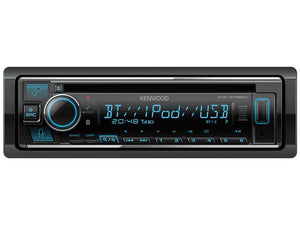 A Sparex KENWOOD car stereo system (Model: KDC-BT665U) with a digital display showing "BT iPod USB," various control buttons, a large volume knob on the left, and built-in Alexa for hands-free control. This system supports Alexa, Bluetooth, FM/AM radio, Aux In, Android devices, iPod/iPhone integration, Spotify app connectivity, USB input, CD playback, and MP3 files.