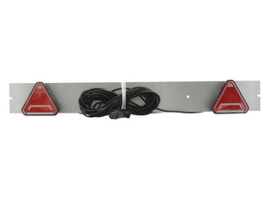 The Sparex LED Lighting Board (S.164125) includes a 1200mm metal bar with two triangular red reflectors, a coiled black cable with an attached plug, and a polycarbonate housing enclosing an LED light that operates at 12 volts. It supports six functions: brake, tail, indicator, fog, number plate illumination, and reflector.