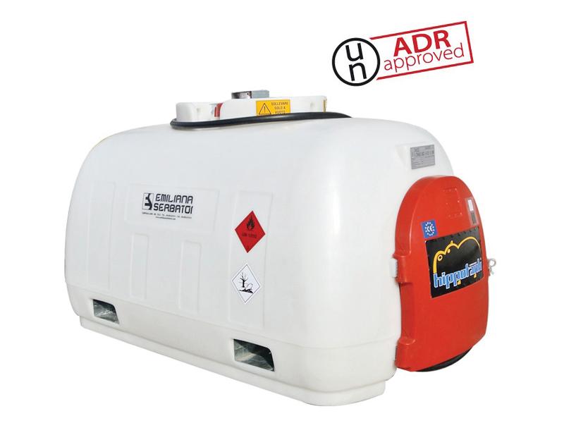 White rectangular tank labeled with "Emiliana Serbatoi," hazardous materials symbol, and "UN ADR approved" label. Features a red access door and a control panel on one end, specifically designed for diesel fuel transportation. Officially known as the Carrytank Transport Tank - HippoTank 960L - Diesel - 12V (DC) by Sparex, Part Number S.165198.