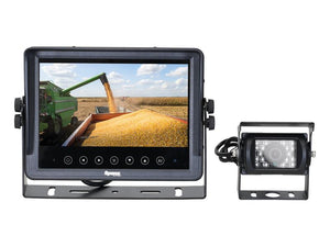 A Wired Waterproof Vehicle Camera System by Sparex, consisting of a 7'' HD waterproof monitor and compact CMOS camera with connected wiring, displays grain being harvested into a truck. The system includes necessary cables and an instruction manual, identified by Sparex Part Number: S.166335.