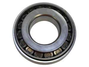 Close-up of the Sparex Taper Roller Bearing (4T-55200C/55437), featuring an inner and outer ring encasing cylindrical rollers; primarily used to reduce friction in rotating mechanical parts. Sparex Part Number: S.166839.