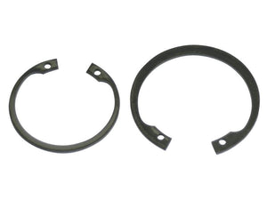 Two metallic circlips: one open-ended on the left and a complete circle on the right, both with small holes on their ends. The open-ended one is an Internal Circlip, 91.2mm (DIN 472), perfect for various applications. Both are available through Sparex under part number S.166853.