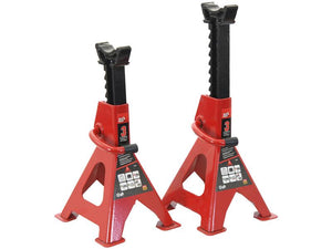 Two red steel axle stands from Sparex, model S.167810, with adjustable heights, designed to support up to 3 tons each. They feature three-leg support for stability, TUV-GS certification, and safety labels on the front.