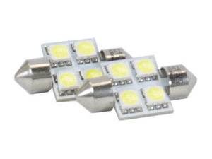 Two Sparex Light Bulb (LED) C5W, 12V, 1W, SV8.5-8 from Agripak each feature six small circular LED elements arranged on a rectangular white base with metal caps at both ends. These S.168428 bulbs are perfect for various lighting applications.