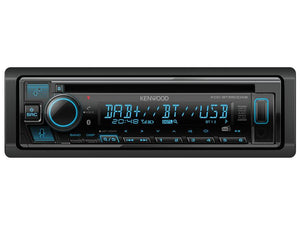 Image of a Sparex KDCBT560DAB in-car stereo system displaying radio, CD, Bluetooth, and USB options with blue backlit buttons and a digital clock showing 20:48. The system also features Alexa built-in for hands-free control via Bluetooth.