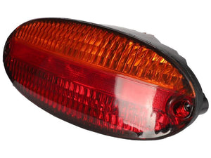 Close-up of a Sparex Rear Light (Halogen) with an oval-shaped red/amber lens and black casing, featuring brake, tail, and indicator functionalities. This right-hand rear light is reminiscent of a John Deere Tail Light, commonly used on automobiles or motorcycles.