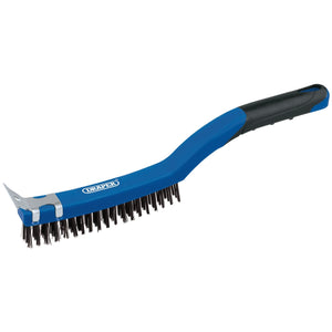 The Draper 3 Row Carbon Steel Wire Scratch Brush With Scraper, model WBSC14, is a blue and black brush featuring carbon steel bristles, a soft grip plastic handle, and a metal scraper at the end.