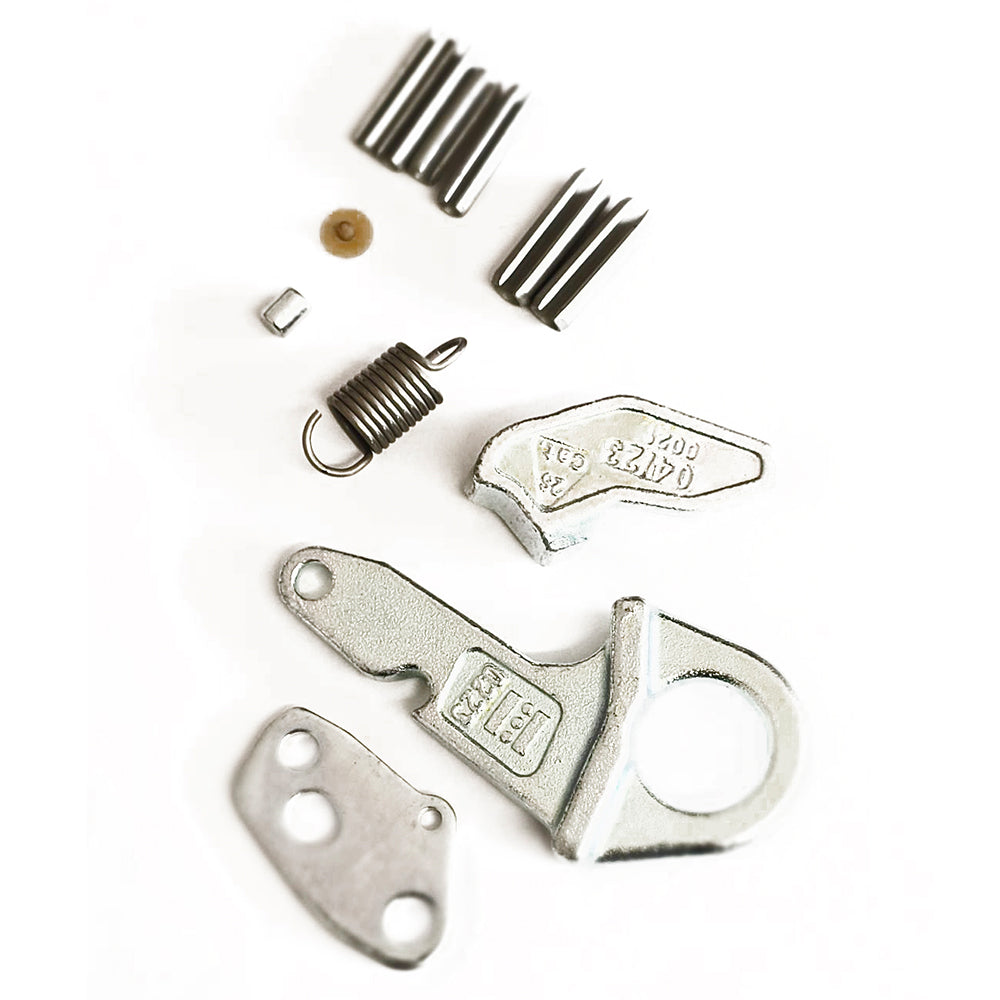 The Sparex Lower Link Hook Repair Kit (Cat. 2S), part number S.33267, featuring assorted metal components including spring pins, springs, and uniquely shaped parts, is arranged on a white background.