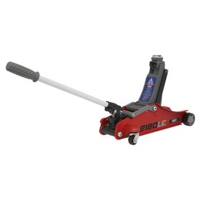 A red 180° Handle Trolley Jack featuring a low profile short chassis, labeled "2180LE" by Sealey, with a gray 180° turning handle raised.