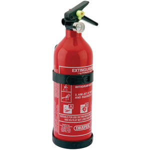 The Draper Dry Powder Fire Extinguisher, 1Kg - FIRE1B from Draper is a red fire extinguisher designed for class A, B, and C fires. It comes with clear instructions for use, a pressure gauge, and a nozzle. The unit is mounted on a black bracket and complies with BS EN 3-7 standards.