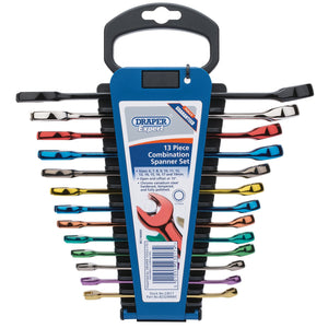 The Draper Expert Hi-Torq® Metric Coloured Combination Spanner Set (13 Piece) - 8232/MM/C is crafted from durable chrome vanadium steel. The spanners come in various colors and are displayed within a blue HI-TORQ® holder featuring a top handle. A label at the center provides product details, and the wall-mountable plastic storage rack ensures convenient organization.