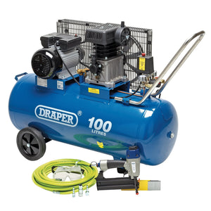 A 100-liter Draper Compressor And Air Nailer Kit - PTKCNK4, featuring attached hoses and accessories such as a green hose and an air nailer, is displayed against a white background.