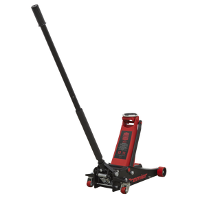 The Sealey Trolley Jack 2.5 Tonne Low Profile with Rocket Lift - 2501LE is a red and black hydraulic floor jack featuring a long handle, polyurethane wheels, and a twin piston rocket lift system for efficient vehicle lifting.