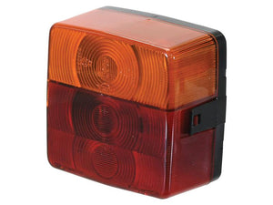 The Sparex Rear Combination Light (Halogen), model S.26050, is a square rear vehicle light designed for both right-hand and left-hand use at 12V. It features an orange upper section and a red lower section, each adorned with circular design elements, and is equipped with a durable polycarbonate lens. This versatile light supports four functions: brake, tail, indicator, and number plate illumination.