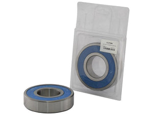 Two ball bearings, including a Sparex Deep Groove Ball Bearing (63092RS) (Agripak 1 pc.) with Sparex Part Number S.27295, are showcased with one placed in front of its original manufacturer's packaging.