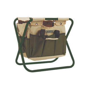 The Draper 2-In-1 Foldable Seat And Bag - FGS/B features a green and beige garden tool bag with multiple pockets mounted on a green metal frame, which also serves as a portable folding chair. Ideal for outdoor activities, this versatile design is perfect for holding and organizing gardening tools wherever you go.