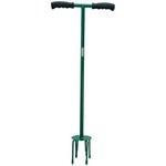 The Draper Soft Grip Handle Garden Tiller - GT/SG, a green T-shaped hand tiller from Draper, features a steel handle and soft grip handles on both ends. The bottom end is equipped with four metal tines for effective soil aeration, ensuring your topsoil is well-prepared for planting.