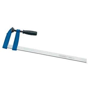 The Draper Quick Action Clamp, 500mm X 120mm - 728F, with a blue finish and a black handle, is perfect for general applications in woodworking or metalworking. It features malleable cast iron jaws, with the base and sliding arm made of metal, and includes measurement indications for precise clamping.