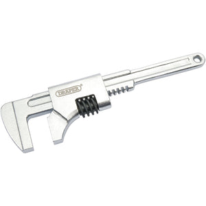 The Draper Adjustable Auto Wrench, 230mm, 60mm - 16, is chrome-plated in silver and features the "Draper" logo on the handle. With wide jaw surfaces for a secure grip and a hole at the end for hanging, this general-purpose wrench is an essential tool.