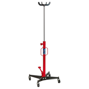 The Sealey Transmission Jack 300kg Vertical - 300ETJ features a sturdy red and black design with a wide base for stability and caster wheels for easy mobility. It offers foot pedal operation for convenient adjustments, includes a secure mount, and has an adjustable height mechanism.