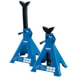 The Draper Ratcheting Axle Stands, 6 Tonne (Pair) - AS6000R by Draper are two blue mechanical jack stands with adjustable heights and large saddles, featuring a ratchet type action for supporting lifted vehicles.