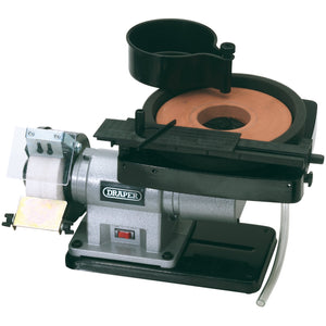 The Draper Wet And Dry Bench Grinder, 350W - GWD205A features an aluminium oxide grinding wheel, tool rest, and a water coolant reservoir on top.