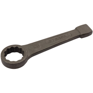 A Draper Ring Slogging Wrench, available in sizes from 32mm to 120mm, is crafted from carbon steel and features a circular, multi-sided closed loop at one end with a flat rectangular handle stamped with the "Draper" brand name. Designed in accordance with DIN7444 Specifications, it promises durability and precision for any task.