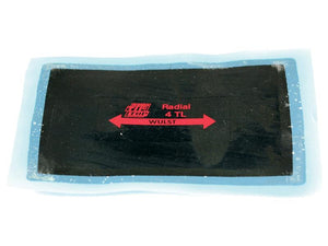 Image of a black rectangular tyre repair patch labeled "Tyre Repair Patch (12TL) 130 x 335mm" from the Sparex brand, featuring a red arrow and text, encased within a clear blue plastic border.