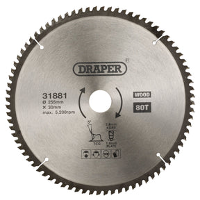 A circular saw blade branded "Draper Tct Triple Chip Grind Circular Saw Blade, 255 X 30mm, 80T - SBTCG1" features an 80-tooth design, a diameter of 255 mm, and a bore size of 30 mm. Suitable for cutting wood at an RPM of 5,200. Safety icons are displayed at the bottom.