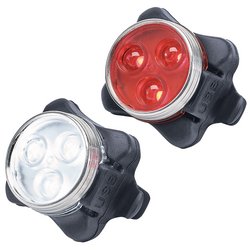 The Draper Rechargeable LED Bicycle Light Set - BK-LS includes a pair of small bike lights, one featuring red LEDs and the other white, both housed in black rubber casings. These USB rechargeable front and rear lights from Draper are IP44 rated, ensuring they're durable and effective for any night ride.