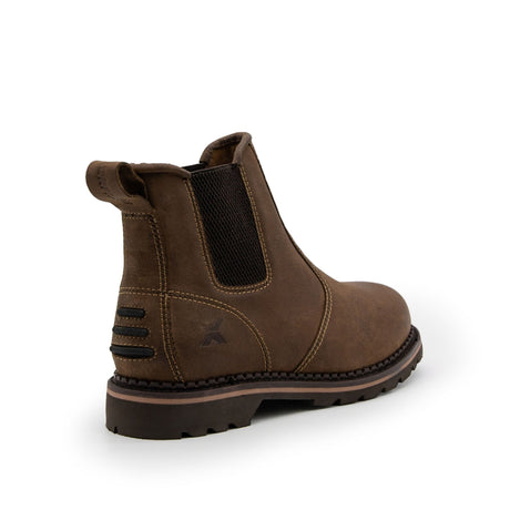 The Xpert Heritage Boulder Non-Safety Boot in brown by Cottonmount features a single leather Chelsea boot with elastic side panels, a pull tab at the back, and a rugged nitrile rubber sole.