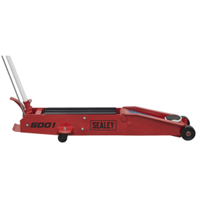 A Sealey Trolley Jack 5 Tonne Long Reach - 5001 in red, featuring a long handle, small wheels, and a foot pedal.
