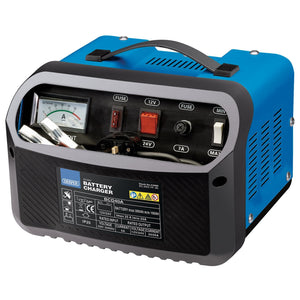 The Draper 12/24V 20-25A Battery Charger - BCD40A is a blue and black unit featuring various switches, fuses, and an amperage gauge on the front panel. It is suitable for charging lead-acid batteries up to 300Ah.