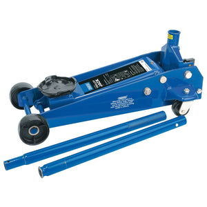 A Draper Garage Trolley Jack, 3 Tonne - TJ3HD/B, in blue with heavy-duty hydraulic functionality, featuring two attached wheels and a removable handle lying beside it on the floor—a perfect addition to any automotive workshop.