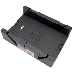 The Draper Mega Mitre Box, 325 X 180 X 60mm - 3618, is a black plastic mitre box designed with angular grooves for guiding saw cuts, making it ideal for cutting coving. This impact-resistant general-purpose box features a central label and a hole for hanging.