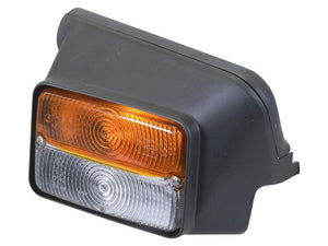 A close-up of the Sparex Front Combination Light (Halogen), 12V, RH, Straight features a black housing with an amber upper section and a clear lower lens.