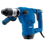 The Draper 230V SDS+ Rotary Hammer Drill, weighing 4.9kg and powered by a robust 1500W motor, offers a blue corded electric design and includes an auxiliary handle for enhanced stability and control—ideal for all your chiseling and drilling tasks.