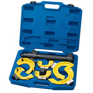 Draper Coil Spring Compressor Kit - N1000B, by Draper, comes in a blue plastic carrying case that contains a set of yellow pipe clamps and a central black fixture with interchangeable jaws, all organized in designated compartments.