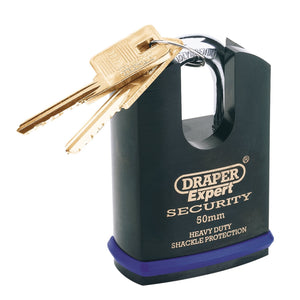 A Draper Expert Heavy Duty Padlock And 2 Keys With Shrouded Shackle, 50mm - 8312/50, featuring a black hardened steel body and two gold keys inserted into the shrouded shackle. The padlock is branded with "Heavy Duty Shackle Protection.