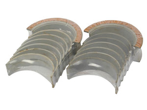 A set of Sparex Main Bearing Standard (Set) from Ford / New Holland, arranged in pairs and showing signs of use and wear.