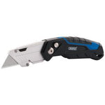 The Draper Folding Trimming Knife With Blade Storage And X 3 Blades (FTK3) features a lightweight design with a black and blue handle, an aluminium alloy silver blade housing, and a quick-change metallic locking mechanism.