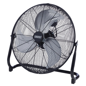 The Draper 230V Floor Fan, model HV18FF, boasts a potent 120W copper motor and three-speed control for effective cooling. This high-velocity fan features a sleek black metal circular frame, housing three silver blades, and measures 18 inches (450mm) in diameter. The iconic "Draper" branding is prominently displayed on the front.