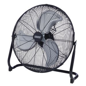 The Draper 230V Floor Fan, 20"/500mm, 120W - HV20FF, from Draper, is a black high-velocity floor fan featuring three silver blades and a circular protective grill. It stands on two curved legs and is powered by a robust copper motor with three-speed control options.