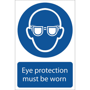 The Draper Eye Protection Mandatory Sign (SS03), measuring 200 x 300mm, features a blue and white design with an icon of a person wearing safety glasses and the text: "Eye protection must be worn." Crafted with UV-resistant ink on durable PVC, it includes a strong adhesive for secure placement.