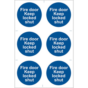 A pack of six blue circular stickers from Draper, known as the "Draper Fire Door Keep Locked' Mandatory Sign (Pack Of 6) - SS08." These durable PVC adhesive stickers feature white text stating "Fire door Keep locked shut," ensuring compliance with the BS5499 Standard. The stickers are printed with UV-resistant ink for long-lasting visibility.