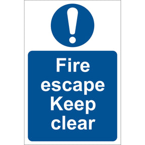 The Draper Fire Escape Keep Clear - SS09 is a UV-resistant blue and white PVC sign with an exclamation mark on top, clearly reading "Fire escape Keep clear." This adhesive notice from Draper guarantees visibility and durability in all conditions.