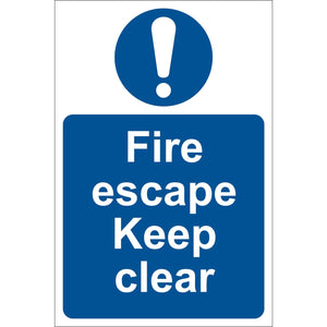 The Draper Fire Escape Keep Clear - SS09 is a UV-resistant blue and white PVC sign with an exclamation mark on top, clearly reading "Fire escape Keep clear." This adhesive notice from Draper guarantees visibility and durability in all conditions.