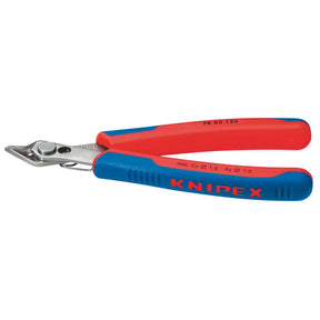 The Draper Knipex 78 03 125 Sbe Electronics Super Knips, measuring 125mm, features red and blue insulated handles. Crafted with precision ground cutting edges from INOX stainless steel and designed for cutting wire, these pliers comply with DIN ISO 9654 specifications, ensuring exceptional durability and performance.
