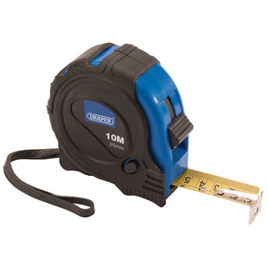 A Draper Measuring Tape, 10M/33Ft X 25mm - EMTG with a black and blue ABS case features a blade locking button for secure measuring, a yellow tape extended to 5 centimeters, and a black wrist strap attached.