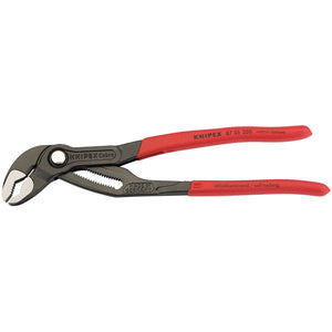 The Draper Knipex Cobra® 87 01 250 Waterpump Pliers, featuring a red handle and self-locking jaw mechanism with a black finish, are crafted from chrome vanadium steel with hardened teeth and positioned facing left.